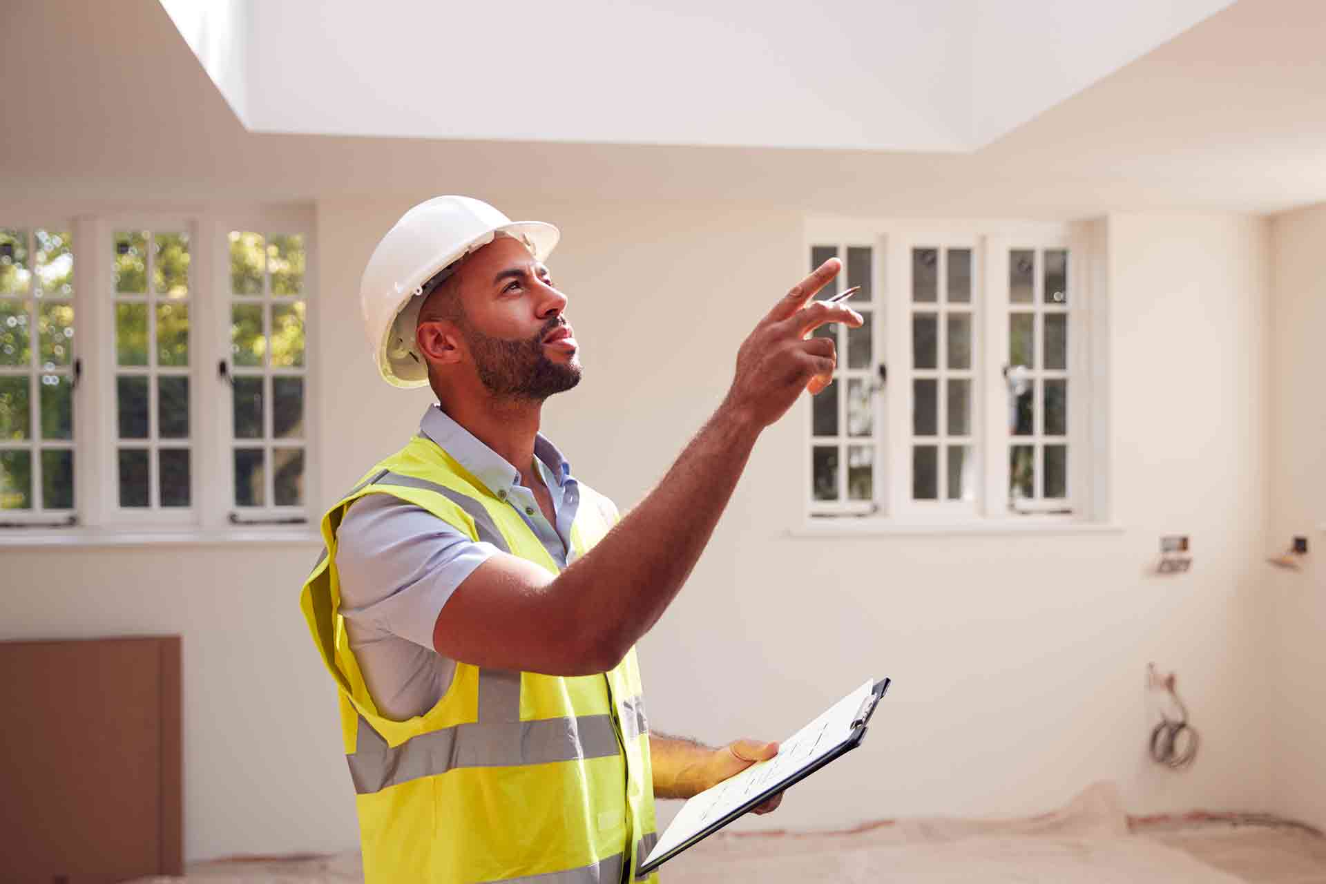 Third Party Wall Surveyors Derby reviewing plans between two parties during a dispute